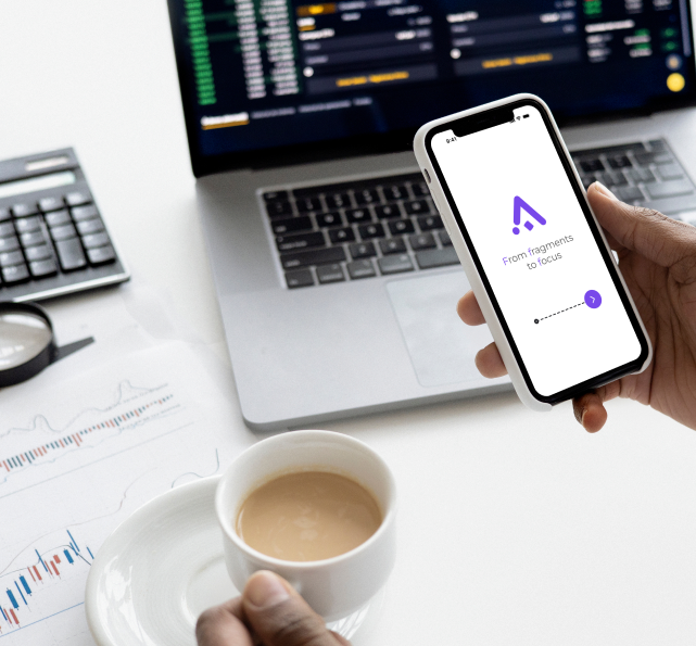AssemFlow on a phone held beside a laptop and working documents