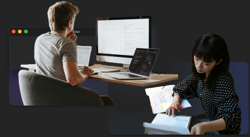 Two people working with documents and several screens, illustrating materials spread across a workflow